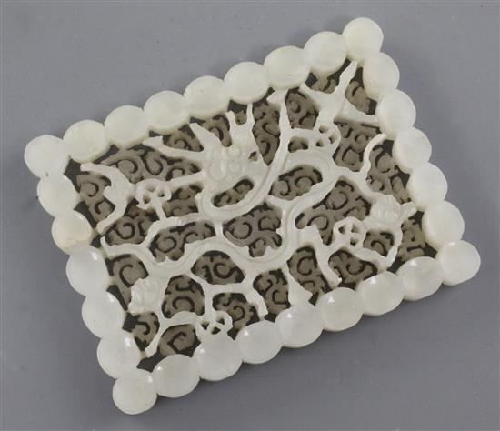 A Chinese white jade rectangular dragon plaque, 17th / 18th century, 5.5 x 7.4cm